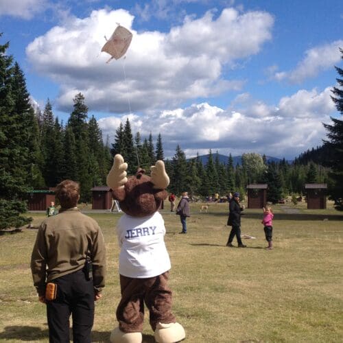 Kite Festival at Lightning Lake, Manning Park: Jerry, our BC Parks mascot flying a kite. The festival combines artistry, outdoor fun, and the sheer joy of seeing kites dance in the beautiful natural setting of Manning Park